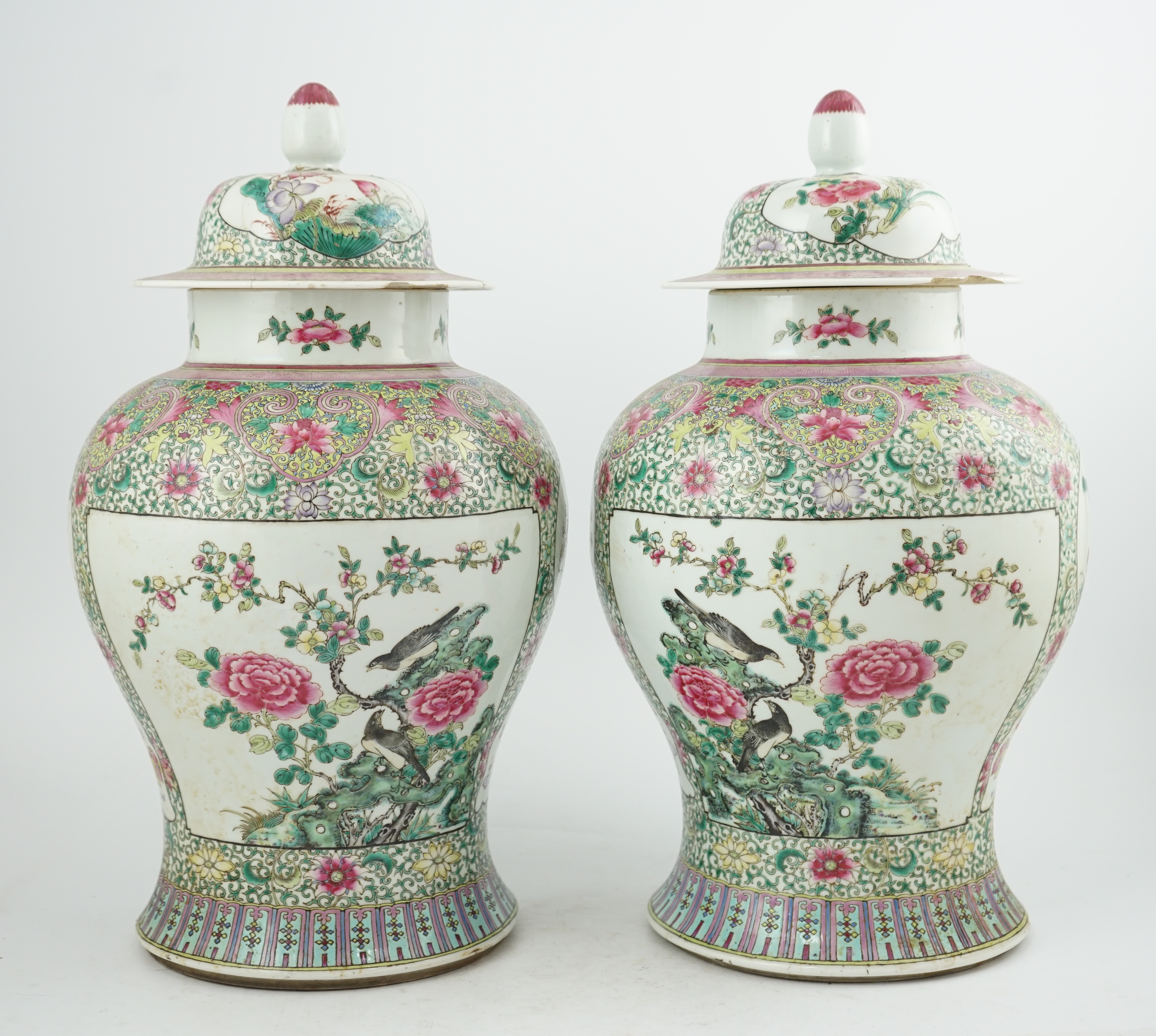 A pair of large Chinese famille rose baluster jars and covers, Qianlong seal mark, but late 19th century